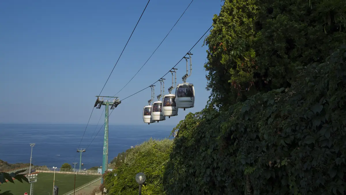 Cable car cabins above the coast